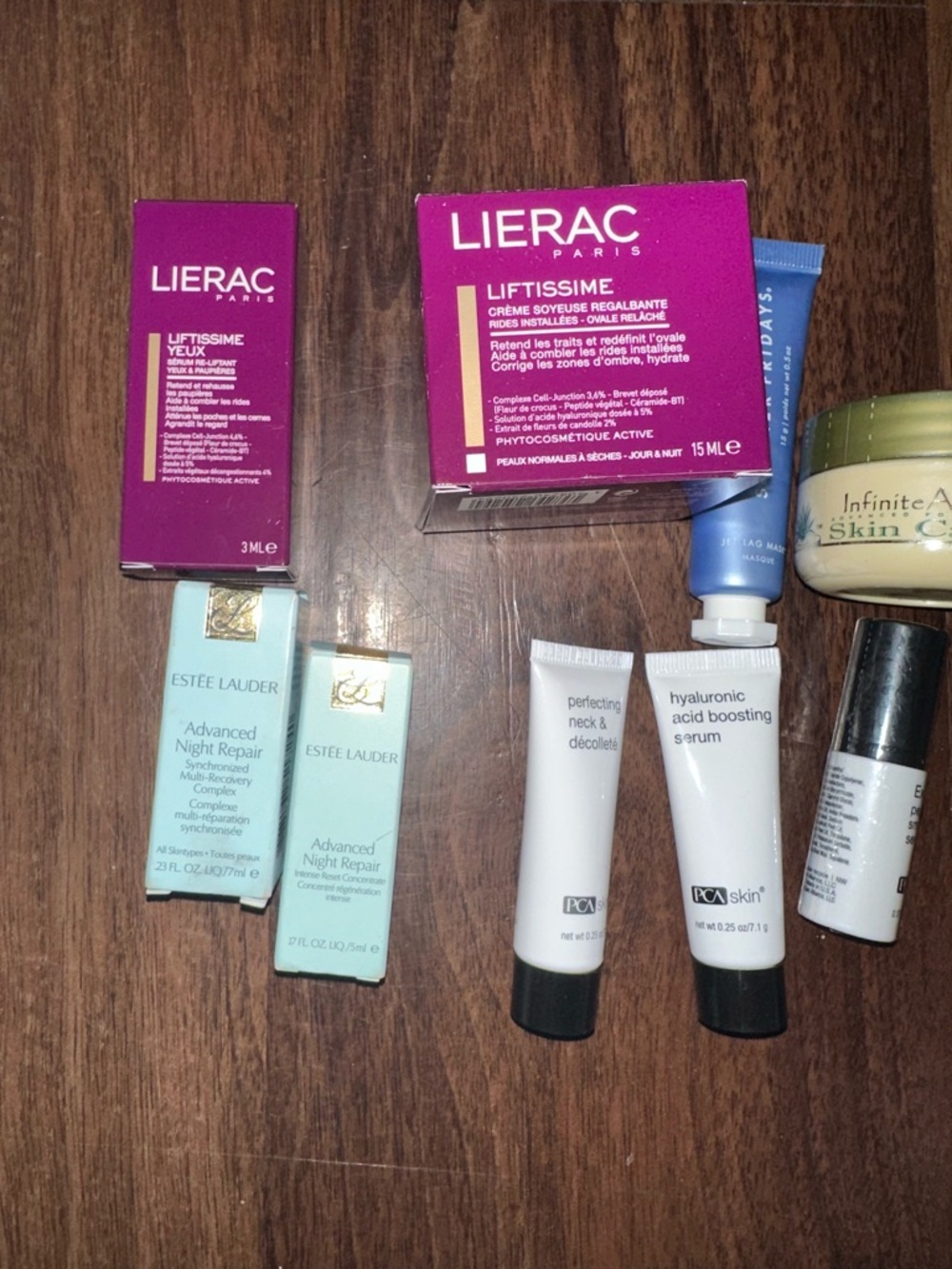 Estee Lauder skincare sampler with pink and white accents